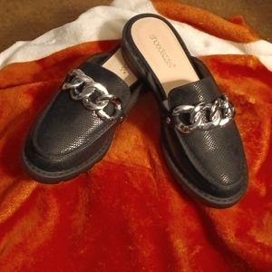 BRAND NEW Slip on black loafer Has a gorgeous silver chain cross the top